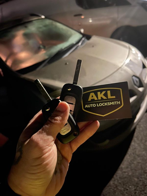 Mobile auto locksmith — spare key cut and programmed at customer location